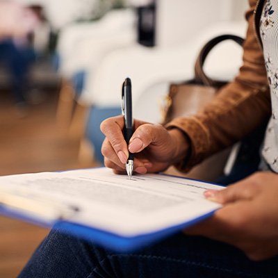 Patient filling out paperwork in lobby
