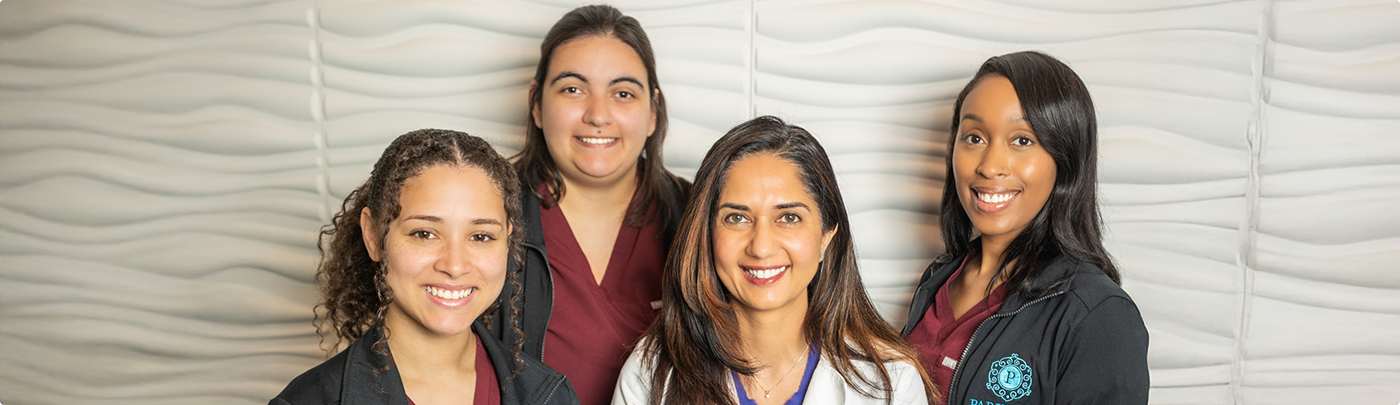 Smiling dentist and team members at Parklane Family Dentistry in Little Elm