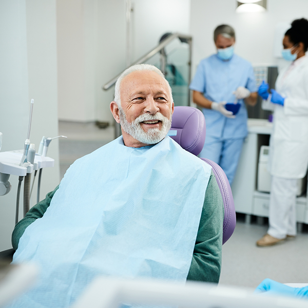 Smiling senior man sitting in the dental chair