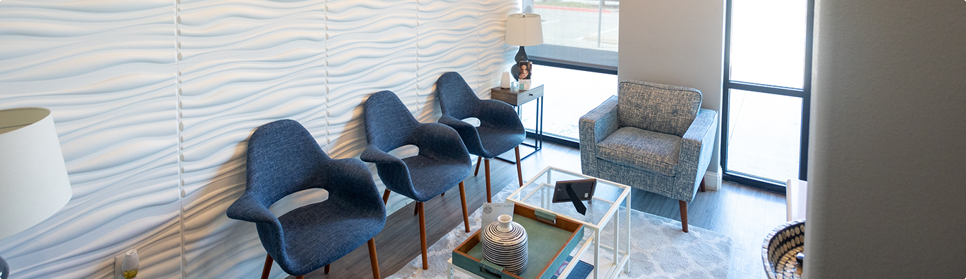Row of chairs in waiting area of dental office in Little Elm