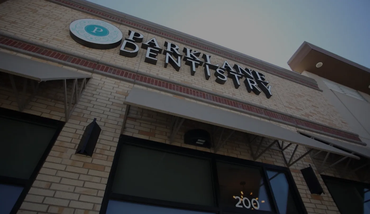 Parklane Family Dentistry sign on the front of a dental office in Little Elm