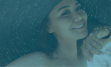 Young woman smiling in a sunhat