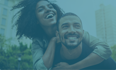 Woman embracing a man from behind