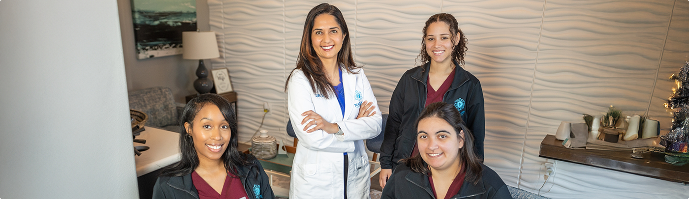 Little Elm dental team members smiling in the dental office