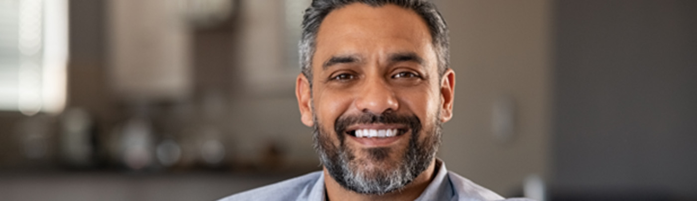 Man sitting on couch and smiling