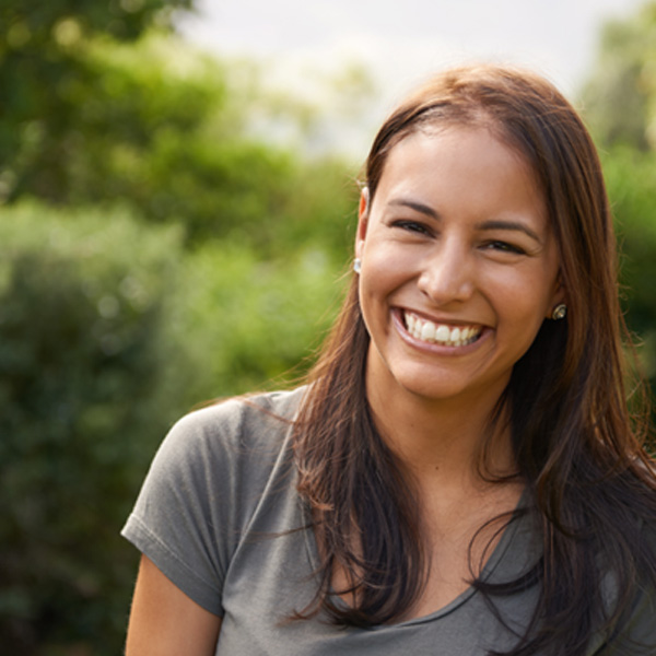 Woman standing outside and smiling